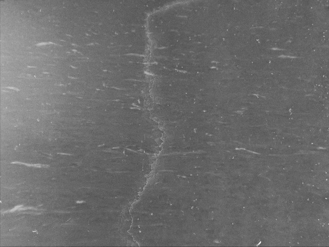 waves raised by wind on the North Atlantic ocean, visibly scratched image tainted by oil of cotoneaster 