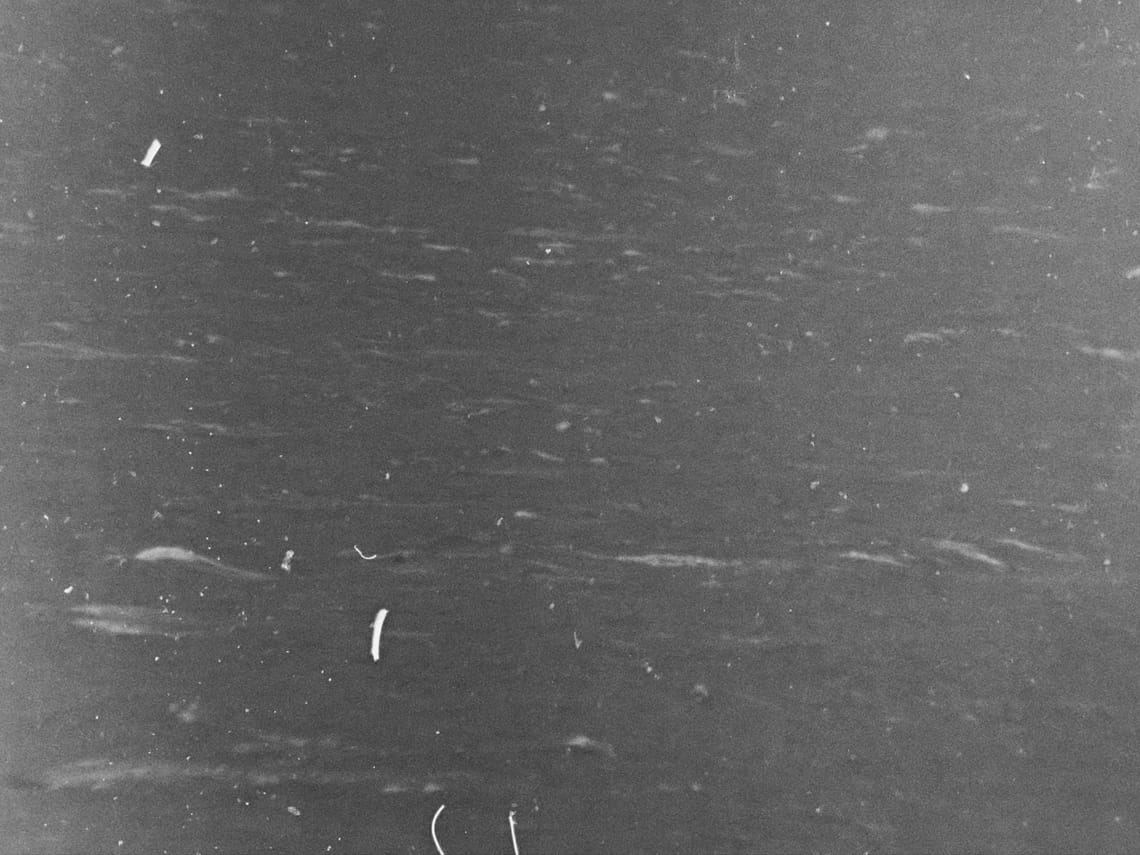 waves raised by wind on the North Atlantic ocean, visibly scratched image tainted by oil of cotoneaster 